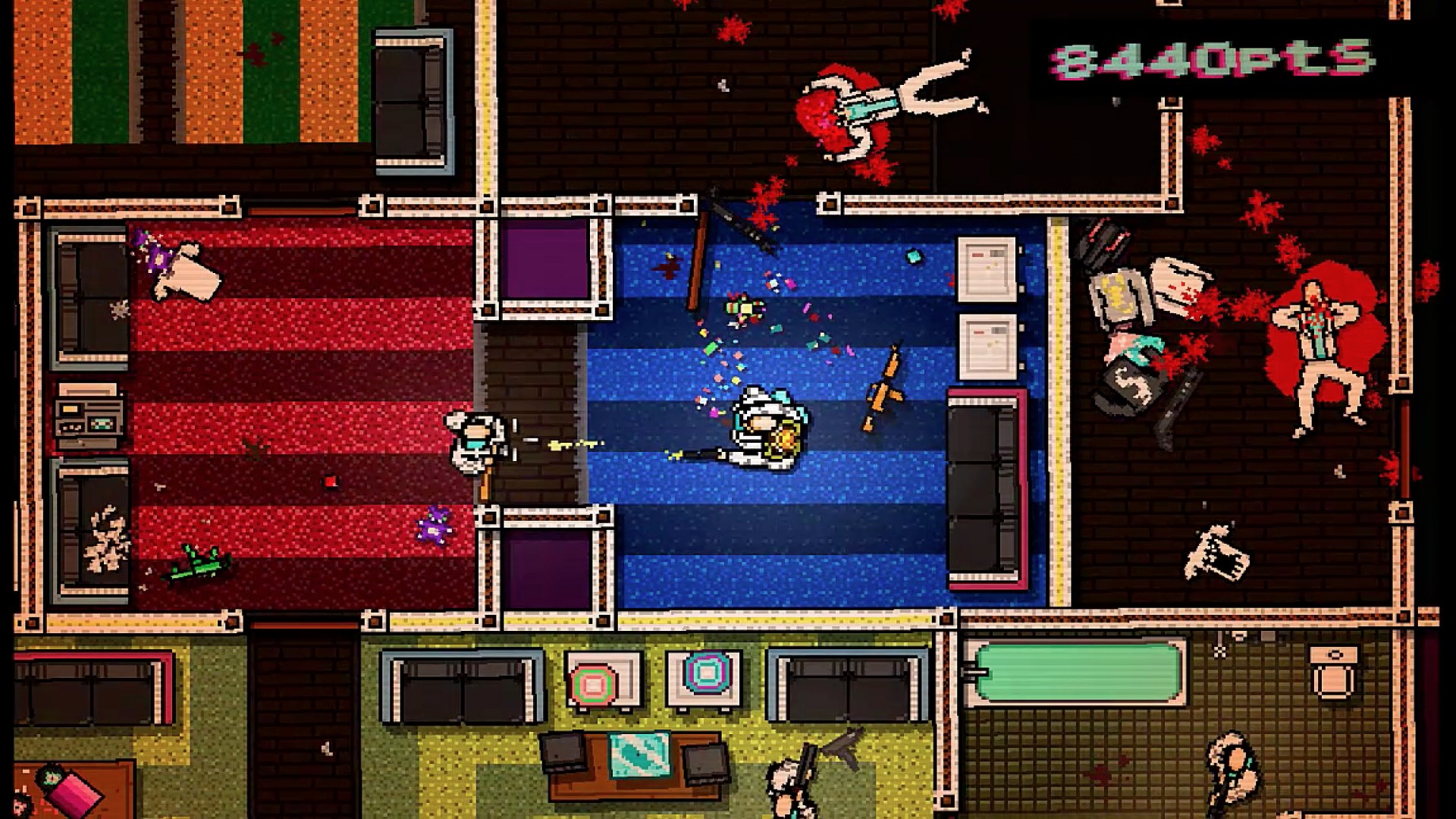 لقطة لعب من Hotline Miami على Xbox تُظهر منظور علوي وأجواء نيّون