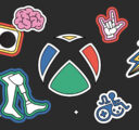 A stylized Xbox logo in support of Gaming & Disability Community with a black background and various icons.